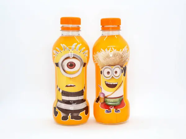 stock image Bottles with Minions characters. Bottles of orange soda. Minion of the movies. Character from the famous Despicable Me movies. Minions in disguise. Beverages. Merchandising. Isolated white.