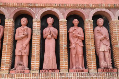 Statues of Thomas Edison, Marie Curie, Gandhi and Ceferino Namuncur decorating the facade of the Rocsen Museum, Crdoba, Argentina. clipart