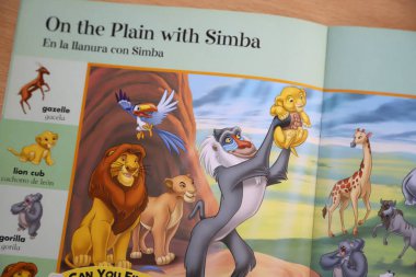 Spanish-English bilingual dictionary for children with illustrations of the birth of Simba from the movie The Lion King clipart