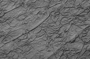 Buruşmuş mat siyah kağıt. Paket kağıdı. Soyut arka plan, duvar kağıdı. Asgari arkaplan 