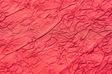 Buruşmuş kırmızı kağıt. Paket kağıdı. Soyut arka plan, duvar kağıdı. Asgari arkaplan 