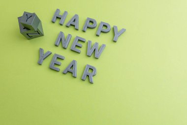 Minimalistic 2025 New Year decoration on a plain background. 3D printed letters. Yellow color background. New Year's celebration  clipart