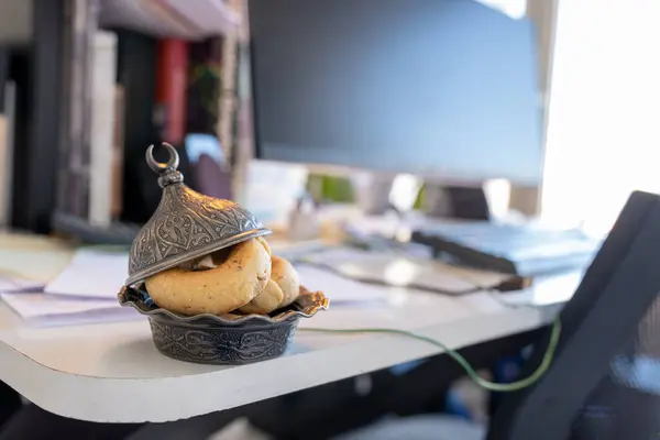 stock image Eid sweets on desk inside working office during ramadan and eid