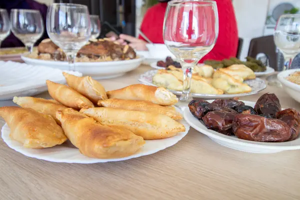 stock image Dish for dates and qatayef on wooden table for ramadan iftar