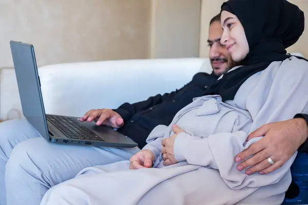 stock image Couples surfing the internet about pregnancy and how to raise baby