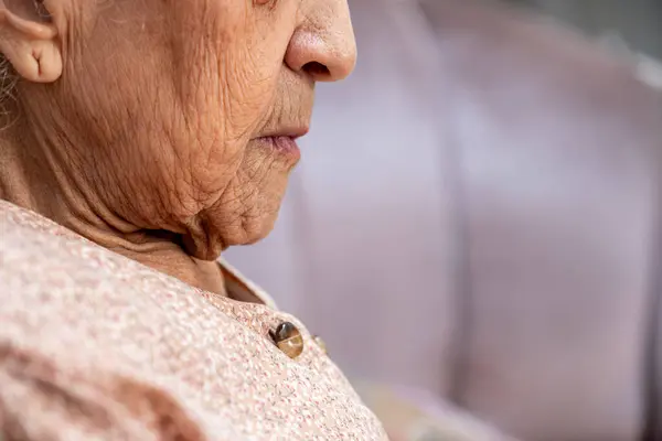 stock image old lady face smiling with some wrinkles on her face