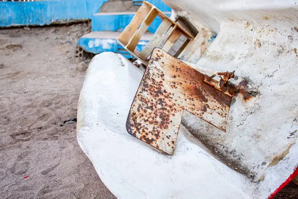 stock image old rustic Ship's steering fin atached to plastic white old boat