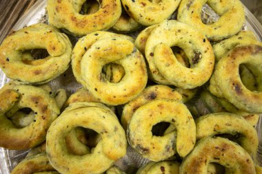 Traditional jordan palestine and syrian eid sweets stuffed with dates from a top view composition also it is color is yellow due to ghee clipart