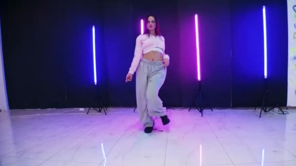 Girl Dancing Front Colorful Neon Lights Energetic Girl Dances Jazz — Stock Video