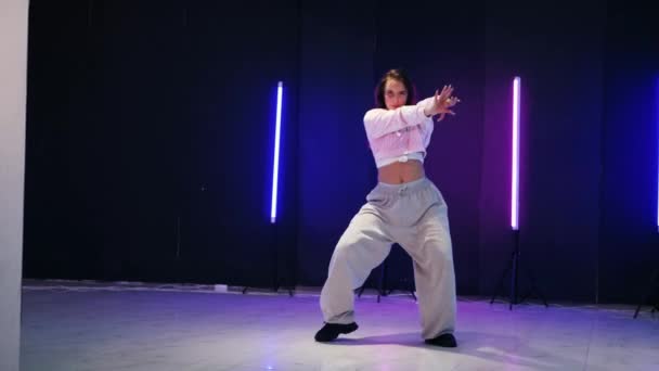 Girl Dancing Front Colorful Neon Lights Energetic Girl Dances Jazz — Stock Video