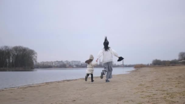 Mother Daughter Enjoying Run Sandy Beach Family Bonding Moment Motion — Stock Video