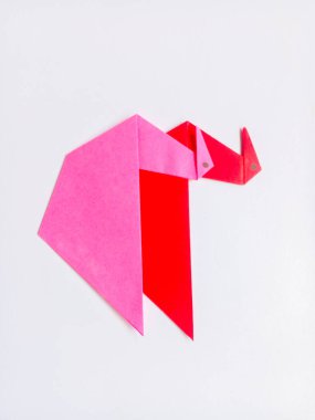 Pink and red swan origami isolated on white background.