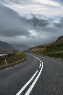 winding road among the mountainous terrain of Iceland. Dramatic photo. clipart