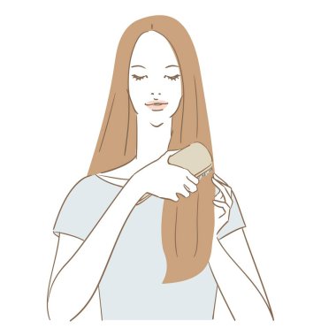 Saçlarını tarayan uzun saçlı güzel bir kadın.