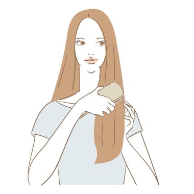 Saçlarını tarayan uzun saçlı güzel bir kadın.