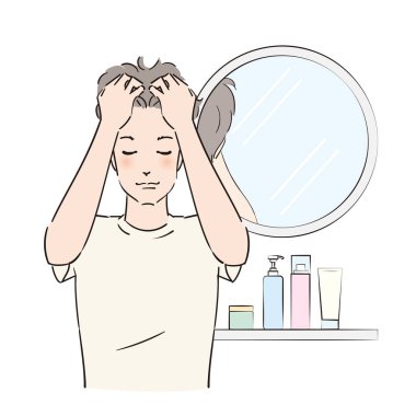 Kafa derisine dikkatlice masaj yapan bir adam.