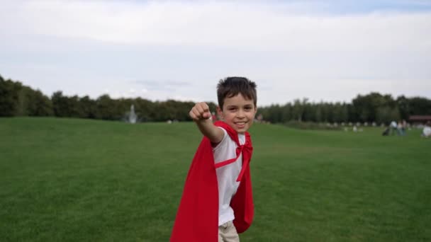 Young Mixed Race Boy Dressed Superhero Costume Running Grassland Camera Stock Footage