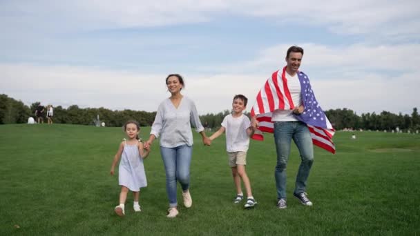 Happy Family Enjoys Leisure Time Walking Field American Flag Surrounded Royalty Free Stock Footage