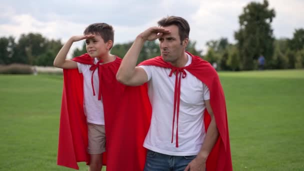 Father Son Wearing Red Capes Playing Heroes Field Trees Grass Stock Video