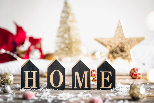 Christmas festive background with decorative word home and holiday decor.