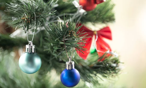 stock image Christmas background with blue Christmas balls on a Christmas tree, on a blurred background.