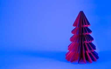 Mavi zemin üzerinde süslemeli kağıt Noel ağacı, modaya uygun neon ışığı, boşluğu kopyala.