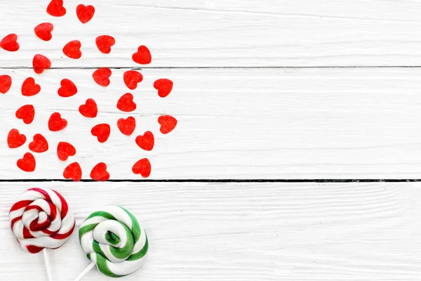 Small Red Hearts Bright Candies Stick White Wooden Background Copy — Stock Photo, Image