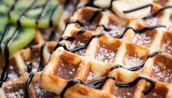 stock image Close-up, appetizing Belgian waffles with fruits, soft focus, food background.