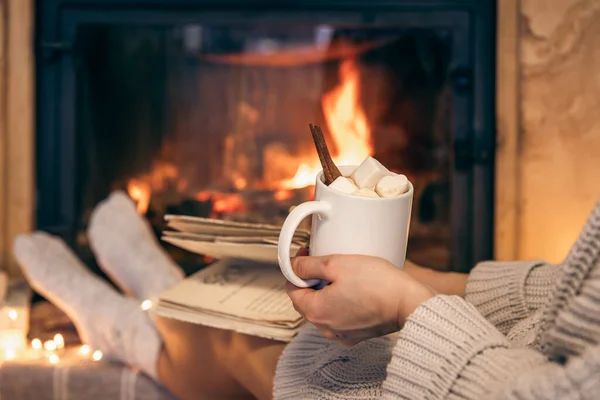 Woman Holding Cup Cocoa Marshmallows Book While Sitting Fireplace Home — Stock Photo, Image