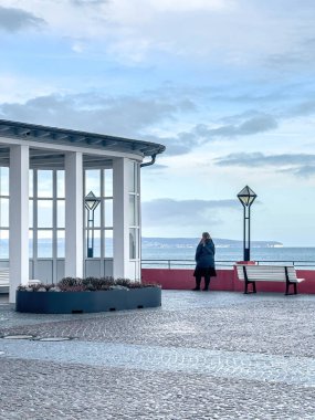Terrace of a cafe overlooking the sea in cloudy weather, a tourist place in the off season.