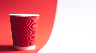 Disposable paper cup in trendy color Viva Magenta, copy space.