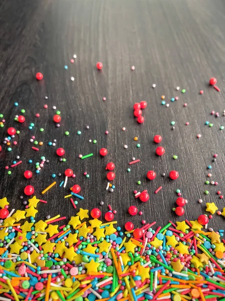 Multicolored Baking Powder Sprinkled Wooden Table Top View — Stock Photo, Image