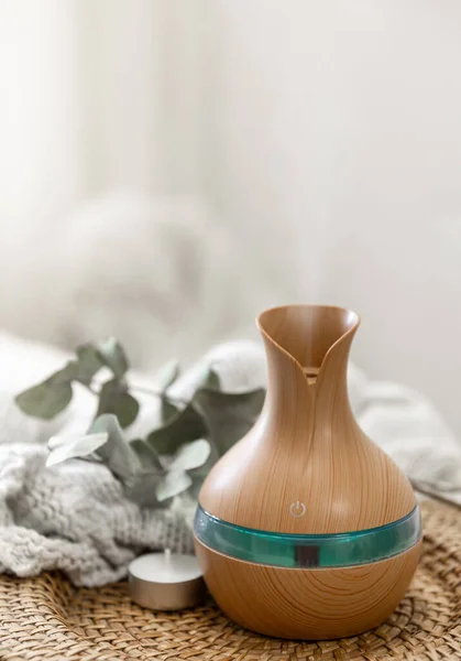 stock image Aroma oil diffuser lamp on a blurred background in the interior of the room, copy space.