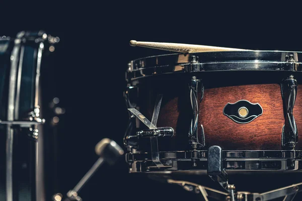 stock image Snare drum on a blurred dark background, part of a drum kit.