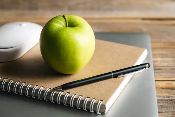 stock image Apple, notepad and laptop on desktop, healthy snack at work or school.