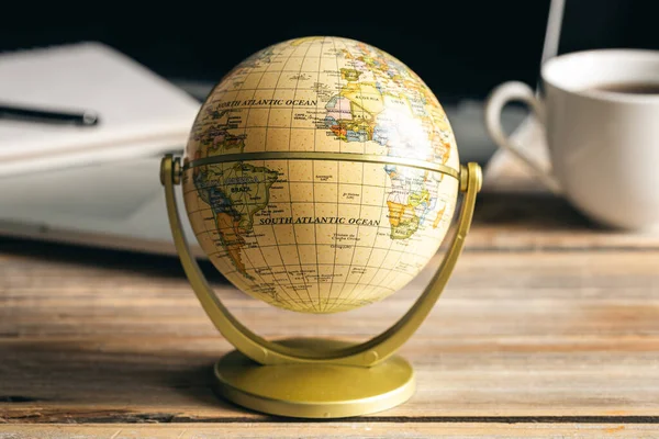 stock image Close up, Earth globe on wooden surface, travel, tourism and geography concept.