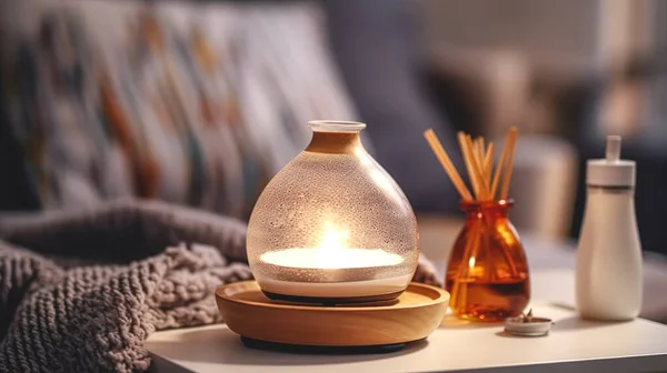 stock image Cozy spa composition with aroma oil diffuser lamp on a blurred background in room interior.