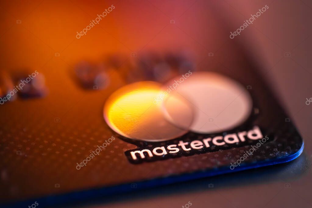 Ukraine, Vinnytsia - December 11, 2024: Mastercard bank credit card. Modern design, reflective surface, detailed textures, realistic bright lighting. Close up.