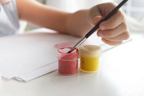 stock image Little child draws with watercolor, concept of education in the kindergarten, soft focus background