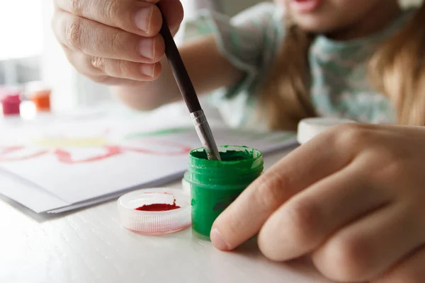 stock image Little child draws with watercolor, concept of education in the kindergarten, soft focus background