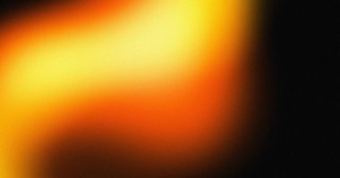 Bulanık turuncu ve sarı renkli arka plan koyu renkli. Sıcak renk tonları ve yumuşak ışık efektleri.