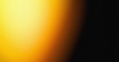 Parlak sarıdan koyu siyaha canlı bir değişim çarpıcı bir soyut arkaplan resmi oluşturur.