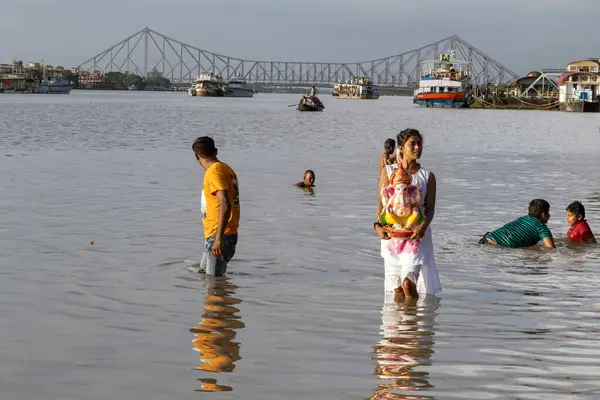 stock image kolkata west bengal india on september 2nd 2022 :Idol of Lord Ganesha is being immersed in Holy river Ganges. Celebrated by Hindus as GANESH CHATURTHI, last day of Gnesh chaturthi festival in Bengal.