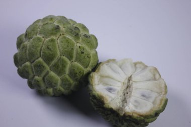 Isolated photo of Srikaya fruit. It has a sweet taste and there are lots of seeds clipart