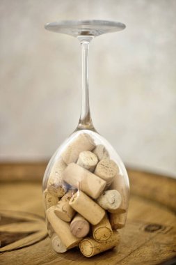Wine glass filled with wine corks, a testament to cherished memories and celebrated moments. clipart
