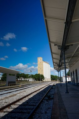 Portalegre, Portugal. May 19, 2024. A tranquil view of Portalegre Railway Station in Portugal, showcasing its charming architecture with classic white and yellow hues.