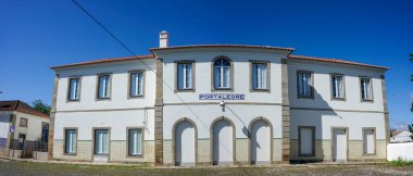 Portalegre, Portugal. May 19, 2024. A tranquil view of Portalegre Railway Station in Portugal, showcasing its charming architecture with classic white and yellow hues.