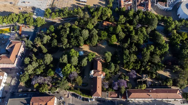 stock image vora, Alentejo. June 16, 2024. Aerial view of vora Public Garden, Portugal: lush greenery, historical pathways, and charming structures creating a serene urban oasis.