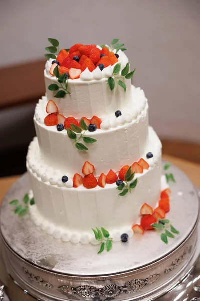 white cream and strawberry wedding cake