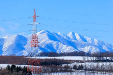 Steel tower and Hidaka Mountains clipart